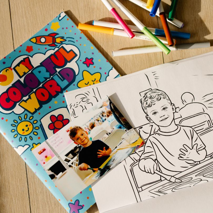 Coloring book titled 'My Colorful World' with markers and coloring pages on a wooden surface