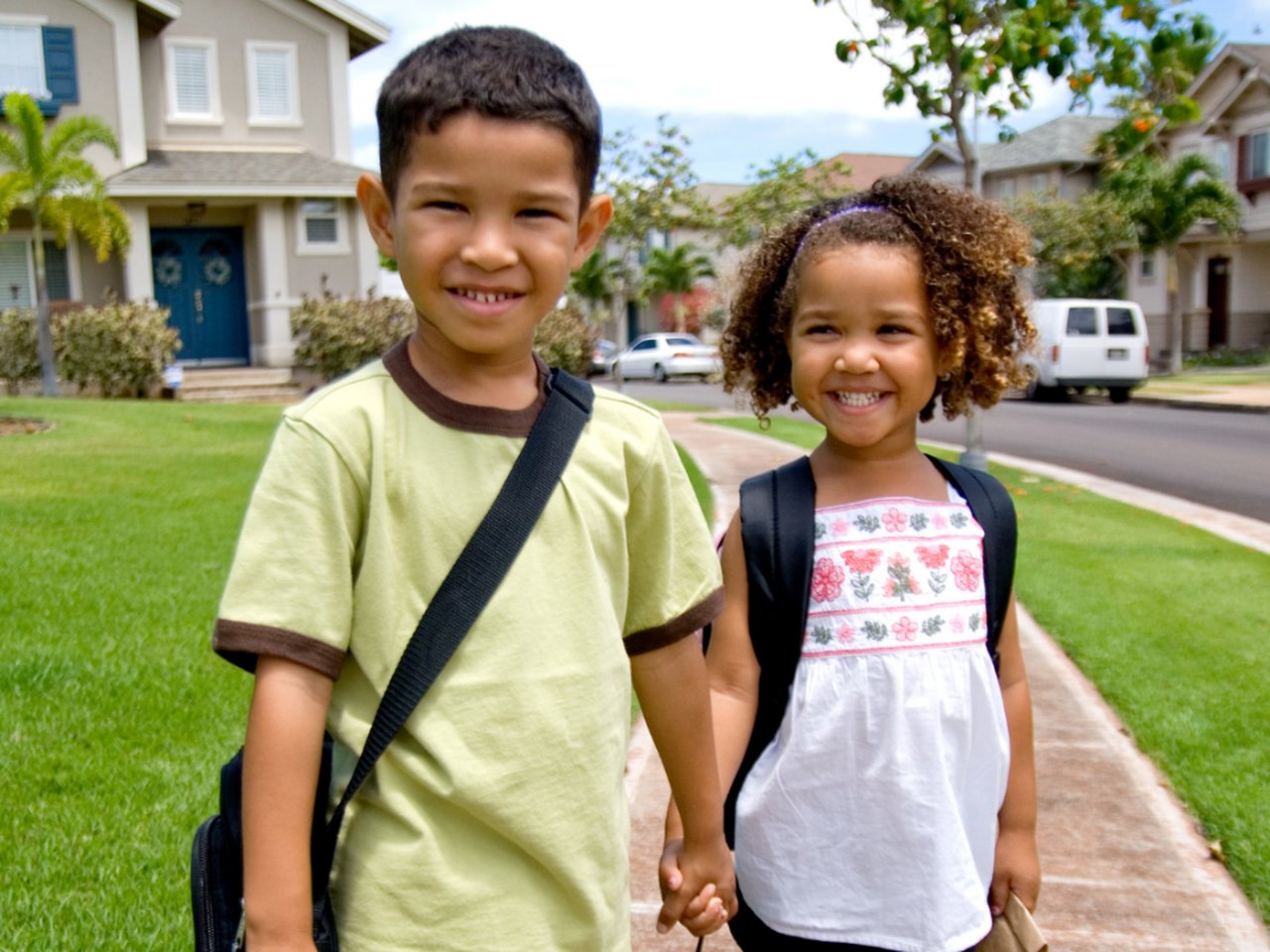 Kids with backpacks and a personalized back to school coloring book
