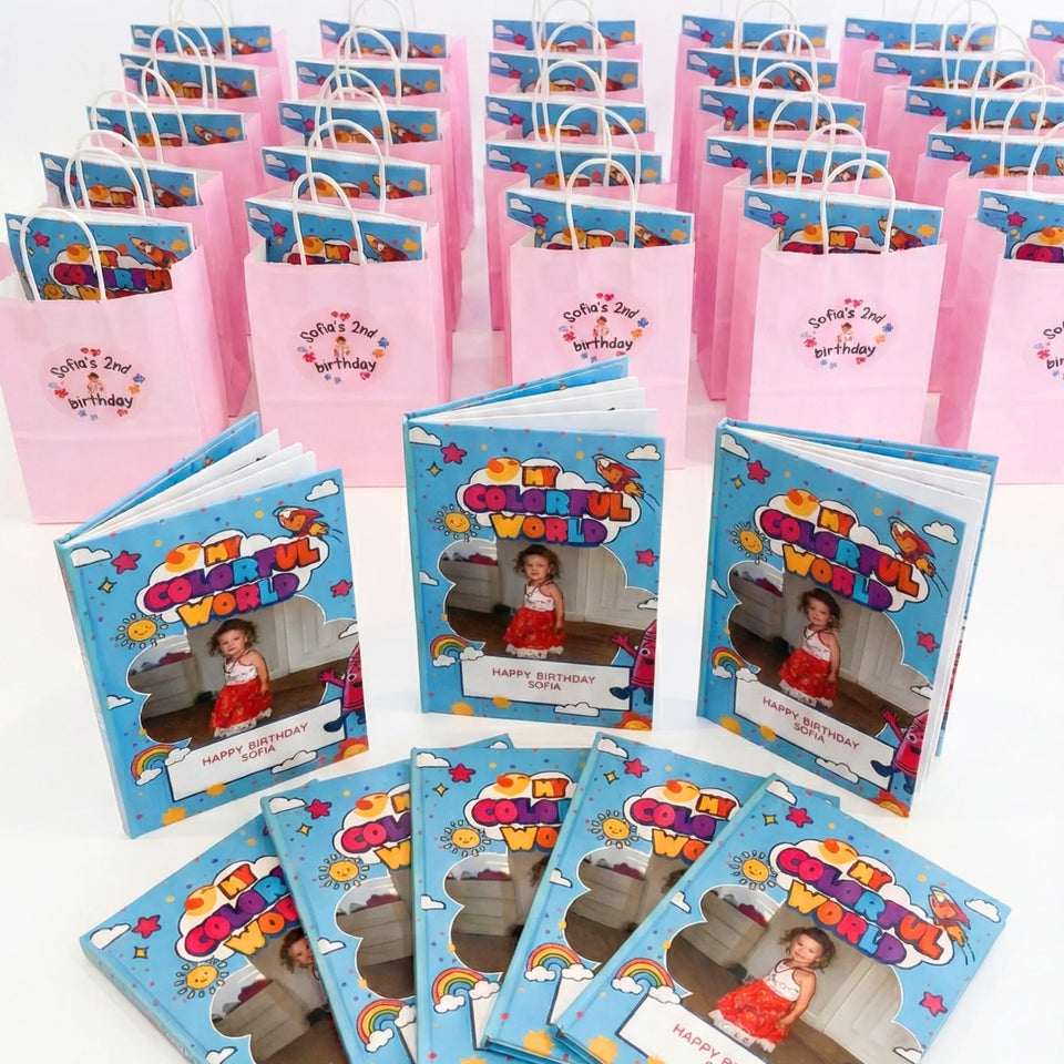 Stacks of personalized coloring books in pink gift boxes